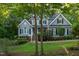 Charming two-story home with meticulously manicured front yard and professional landscaping enhancing the curb appeal at 945 Jones Wynd, Wake Forest, NC 27587