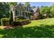 Beautiful two-story home with lush front lawn, mature landscaping, and inviting front entrance, in a desirable neighborhood at 945 Jones Wynd, Wake Forest, NC 27587