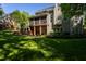 Exterior view of home with a covered patio and well-manicured lawn, showcasing its curb appeal at 945 Jones Wynd, Wake Forest, NC 27587