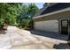 Spacious two-car garage with driveway in a lush neighborhood, adding practicality to the property's overall appeal at 945 Jones Wynd, Wake Forest, NC 27587