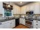 Well-equipped kitchen with stainless steel appliances and ample counter space at 945 Jones Wynd, Wake Forest, NC 27587