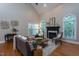 Bright living room featuring hardwood floors and backyard access at 945 Jones Wynd, Wake Forest, NC 27587