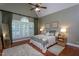 Spacious main bedroom featuring a vaulted ceiling, ceiling fan, and large windows at 945 Jones Wynd, Wake Forest, NC 27587