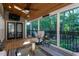 Screened porch featuring wood ceiling, an overhead fan, and a seating area with nature views at 945 Jones Wynd, Wake Forest, NC 27587