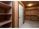 Spacious walk-in closet with built-in shelves and ample storage space for an organized wardrobe at 945 Jones Wynd, Wake Forest, NC 27587