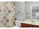 Bathroom with a decorative shower curtain, vanity, and mirror at 9508 Vira Dr, Raleigh, NC 27617