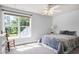 Cozy bedroom with a large window, natural light, and plush carpet at 9508 Vira Dr, Raleigh, NC 27617