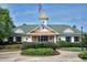 View of the Brier Creek community clubhouse with manicured landscaping at 9508 Vira Dr, Raleigh, NC 27617