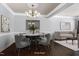 Cozy dining area with stylish seating and a decorative chandelier fixture at 9508 Vira Dr, Raleigh, NC 27617