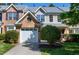 Charming townhome featuring a white garage door, brick facade, and well-maintained landscaping, creating inviting curb appeal at 9508 Vira Dr, Raleigh, NC 27617