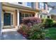 Inviting front entrance with a blue door, classic wreath, and vibrant landscaping, creating a warm and welcoming atmosphere at 9508 Vira Dr, Raleigh, NC 27617