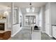 Eat-in kitchen featuring gray walls, tile floors, a butcher block island, skylight, and white trim at 9508 Vira Dr, Raleigh, NC 27617