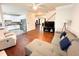 Open floor plan featuring living room and kitchen with stainless steel appliances at 9508 Vira Dr, Raleigh, NC 27617