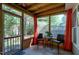 Relaxing screened porch with seating, table, and peaceful backyard views at 9508 Vira Dr, Raleigh, NC 27617