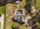 Aerial view of the house highlighting its roof, yard, and surrounding trees at 1006 Trumpet Vine Ct, Wendell, NC 27591