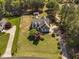 An aerial view of a beautiful home with a well-maintained lawn and mature trees at 1006 Trumpet Vine Ct, Wendell, NC 27591