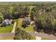 An aerial view of a home with lush lawns and mature trees in a well-established neighborhood at 1006 Trumpet Vine Ct, Wendell, NC 27591