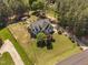 A great aerial view of this large home with well manicured lawn and surrounding wooded area at 1006 Trumpet Vine Ct, Wendell, NC 27591