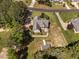 An aerial view displays a home with manicured lawns, a patio, and a detached shed at 1006 Trumpet Vine Ct, Wendell, NC 27591