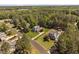 Aerial view of a beautiful home surrounded by mature trees and well-manicured lawns at 1006 Trumpet Vine Ct, Wendell, NC 27591