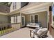 Comfortable seating on the back deck with a painted blue ceiling at 1006 Trumpet Vine Ct, Wendell, NC 27591