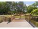 A well maintained back yard featuring mature trees and a shed at 1006 Trumpet Vine Ct, Wendell, NC 27591