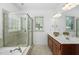 Bathroom featuring a double sink vanity, a shower, and a soaking tub at 1006 Trumpet Vine Ct, Wendell, NC 27591