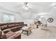 Bonus room boasts a seating area, a desk, and a cozy leather sofa at 1006 Trumpet Vine Ct, Wendell, NC 27591