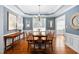 Formal dining room boasts a decorative tray ceiling and ample natural light at 1006 Trumpet Vine Ct, Wendell, NC 27591