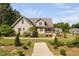 Charming two-story home with beautifully landscaped front yard and garden at 1006 Trumpet Vine Ct, Wendell, NC 27591