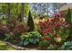 Beautifully landscaped garden with vibrant flowers, lush greenery, and manicured shrubs at 1006 Trumpet Vine Ct, Wendell, NC 27591