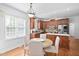 Eat-in kitchen with stainless steel appliances and table with seating for four at 1006 Trumpet Vine Ct, Wendell, NC 27591