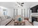 Bright living room features hardwood floors, neutral paint, and a cozy fireplace at 1006 Trumpet Vine Ct, Wendell, NC 27591