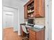 Home office features a built-in desk and a chair with hardwood flooring at 1006 Trumpet Vine Ct, Wendell, NC 27591