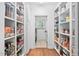 Walk-in pantry with custom shelving offering lots of storage space at 1006 Trumpet Vine Ct, Wendell, NC 27591