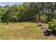A grassy backyard featuring a volleyball net ready for a friendly game at 1006 Trumpet Vine Ct, Wendell, NC 27591