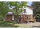 Charming home with a brick and siding exterior, a wooden deck, and a lush green lawn at 101 Atchison St, Garner, NC 27529