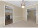 Dining area with a view of kitchen and another room at 101 Atchison St, Garner, NC 27529