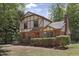 Beautiful Tudor-style home with a well-maintained lawn and mature trees at 101 Atchison St, Garner, NC 27529