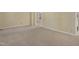 Neutral living room with fresh carpet and well-lit by natural light at 101 Atchison St, Garner, NC 27529