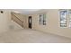 Open living area with access to a staircase and a front door at 101 Atchison St, Garner, NC 27529