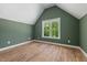 Bedroom featuring sleek hardwood floors, paint in a neutral tone, and a window with a view at 1013 Forrestal Pl, Durham, NC 27707