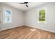 Bedroom with windows and hardwood floors at 1013 Forrestal Pl, Durham, NC 27707