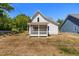 Exterior shot of the home with a screened-in porch at 1013 Forrestal Pl, Durham, NC 27707
