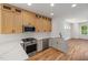 Modern kitchen with stainless steel appliances, white countertops, and stylish cabinets at 1013 Forrestal Pl, Durham, NC 27707