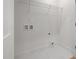 Laundry room with storage shelf, tiled floors and hookups for washer/dryer at 1013 Forrestal Pl, Durham, NC 27707