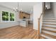 Open floorplan with hardwood floors, adjacent to the kitchen and staircase at 1013 Forrestal Pl, Durham, NC 27707