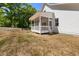 Exterior angle of the porch with wood floor, screened-in walls and white railings at 1013 Forrestal Pl, Durham, NC 27707