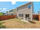 Backyard featuring a patio, grill, outdoor furniture, and privacy fence with green trees beyond at 1021 Sweet Cream Ct, Durham, NC 27703