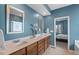 Spacious bathroom with double vanity and an entrance to a Primary suite at 1021 Sweet Cream Ct, Durham, NC 27703